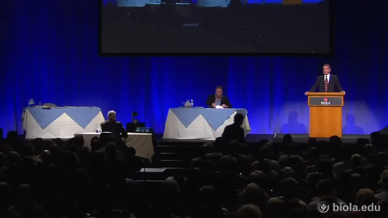 William Lane Craig and Christopher Hitchens on the debate stage at Biola University, with the audience in the foreground